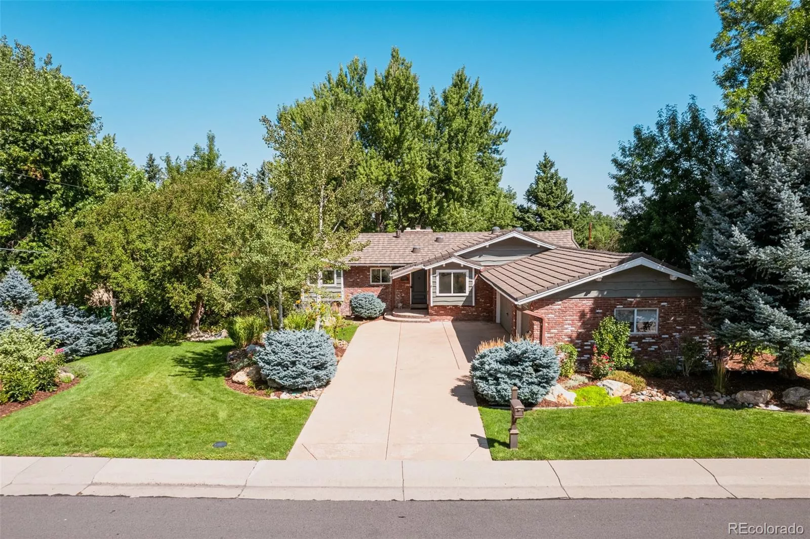 Perfectly placed in the picturesque Applewood neighborhood, this enchanting cottage exudes timeless charm and irresistible curb appeal greeting you with a vision of storybook beauty framed by lush greenery and a symphony of blooming flowers.