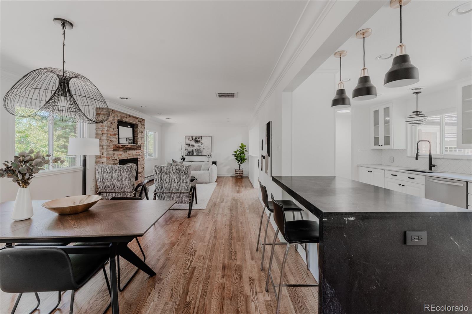 Generous seating space at the kitchen bar and dining area ensures that the space is comfortable and inviting, perfect for hosting gatherings or enjoying everyday meals.