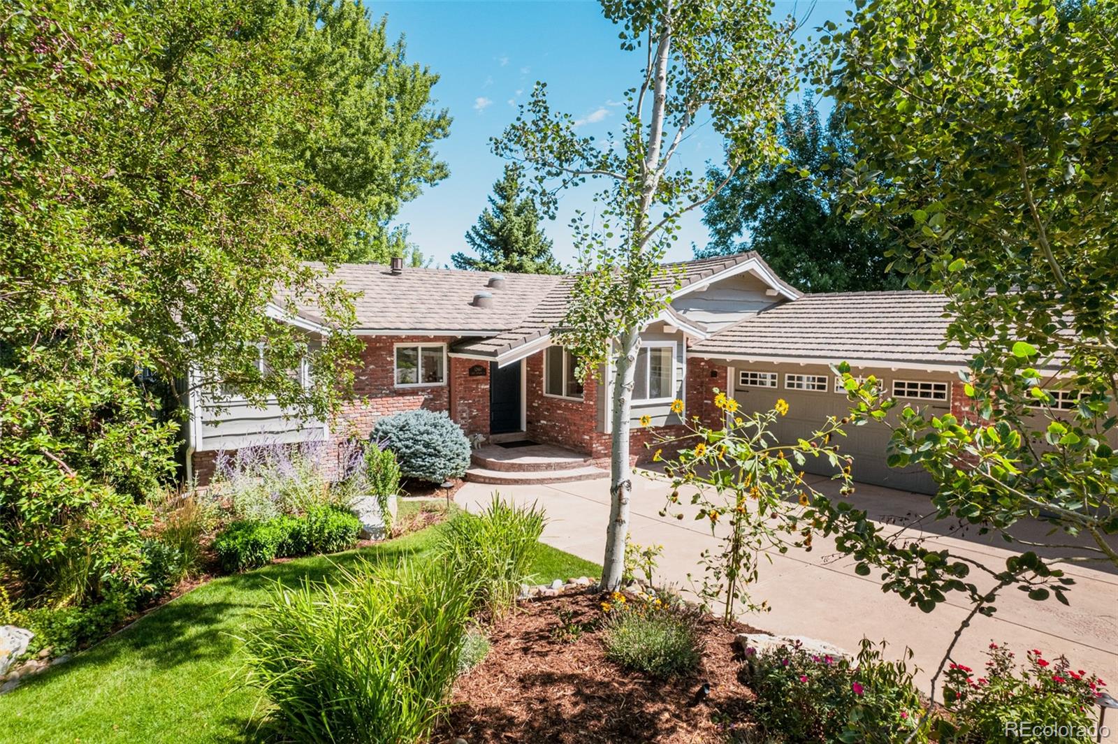 Whether it's housing vehicles, outdoor equipment, or seasonal decor, this expansive three car garage ensures that everything has its place. A 50 year stone coated metal roof is an added bonus.