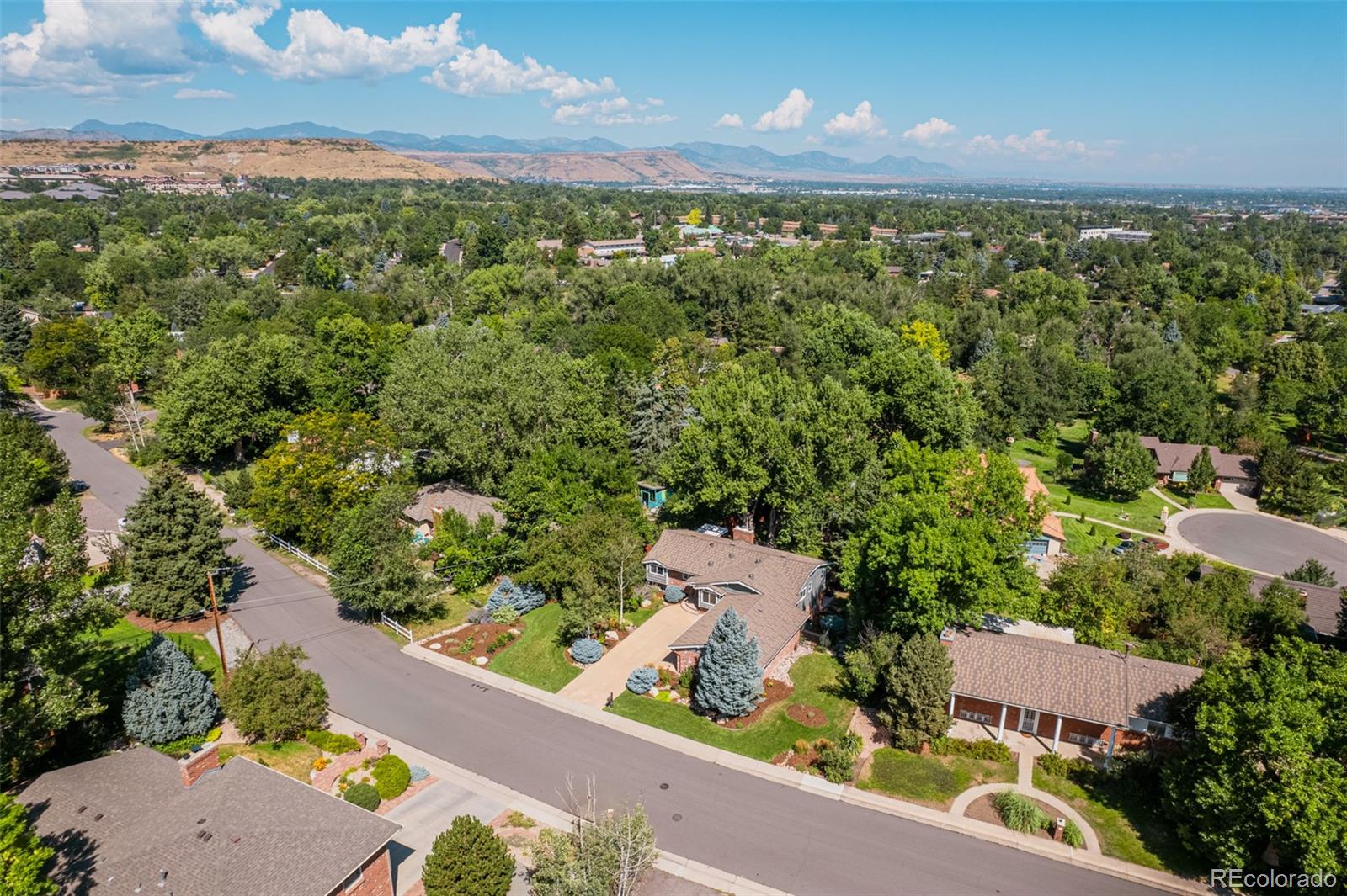 This home, with its generous .38 acre yard, provides a serene retreat just 15 to 20 minutes from the vibrant heart of downtown Denver or the breathtaking majesty of the mountains.