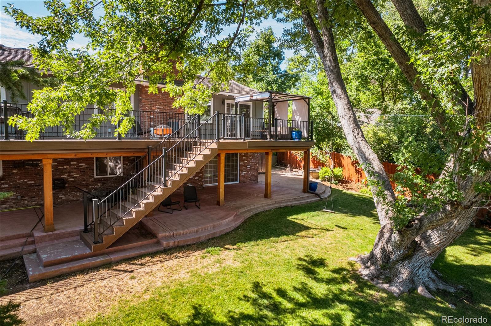 A magnificent deck spans the entire length of the home, complemented by multiple inviting patios, each designed for hosting lively gatherings and intimate celebrations.