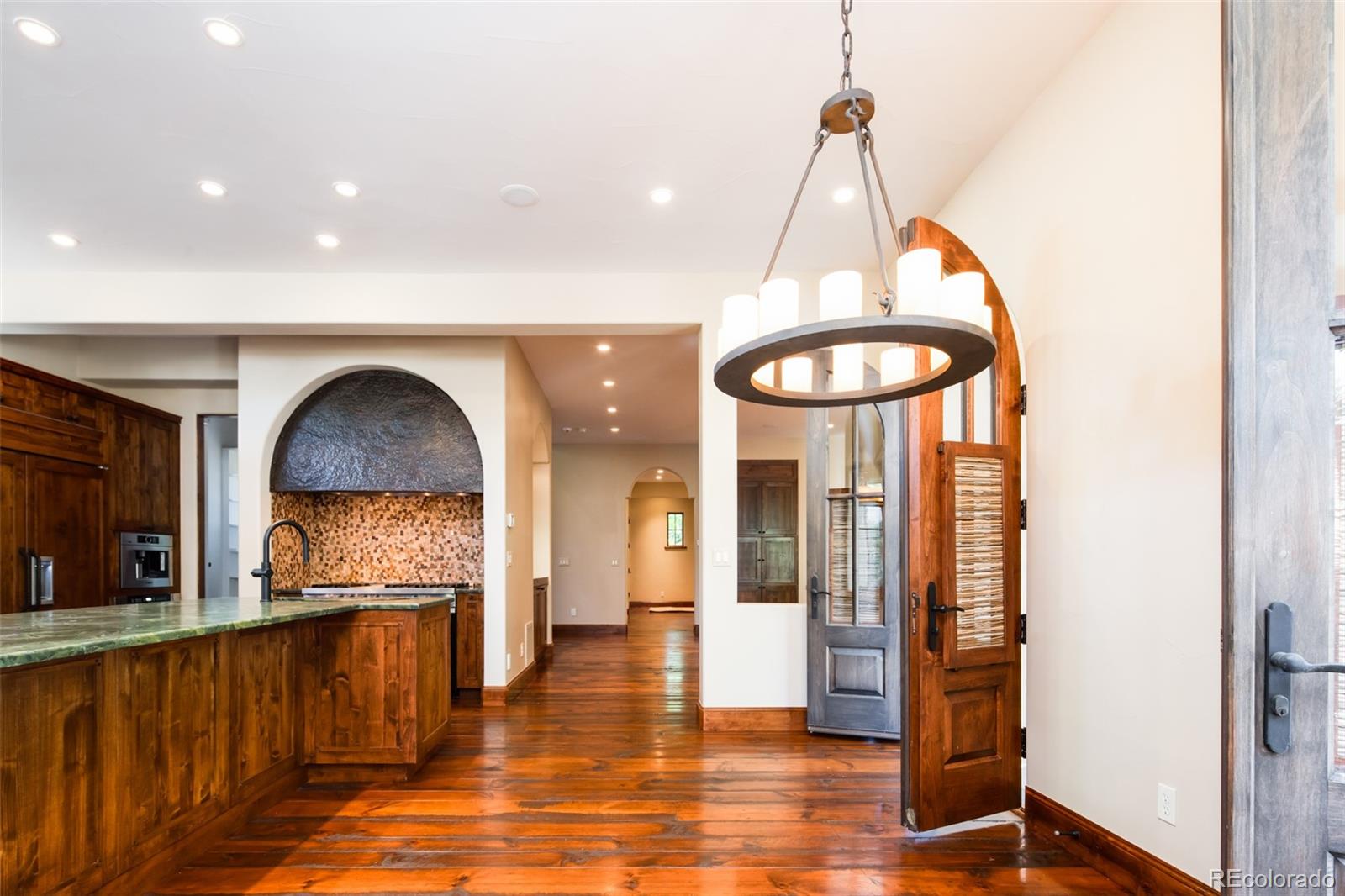 Dining Area with Four Doors Leading to Outside Entertainment Area