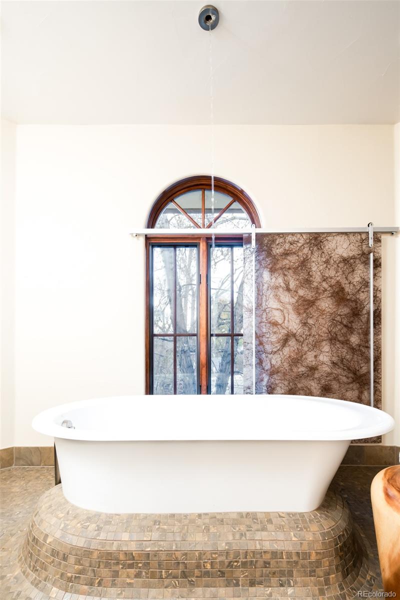 Primary Bath with Ceiling Mounted Faucet and Vintage Drain