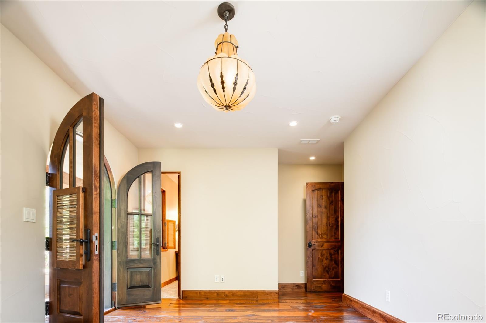 Secondary Bedroom #1 with Handblown Italian Glass Globe