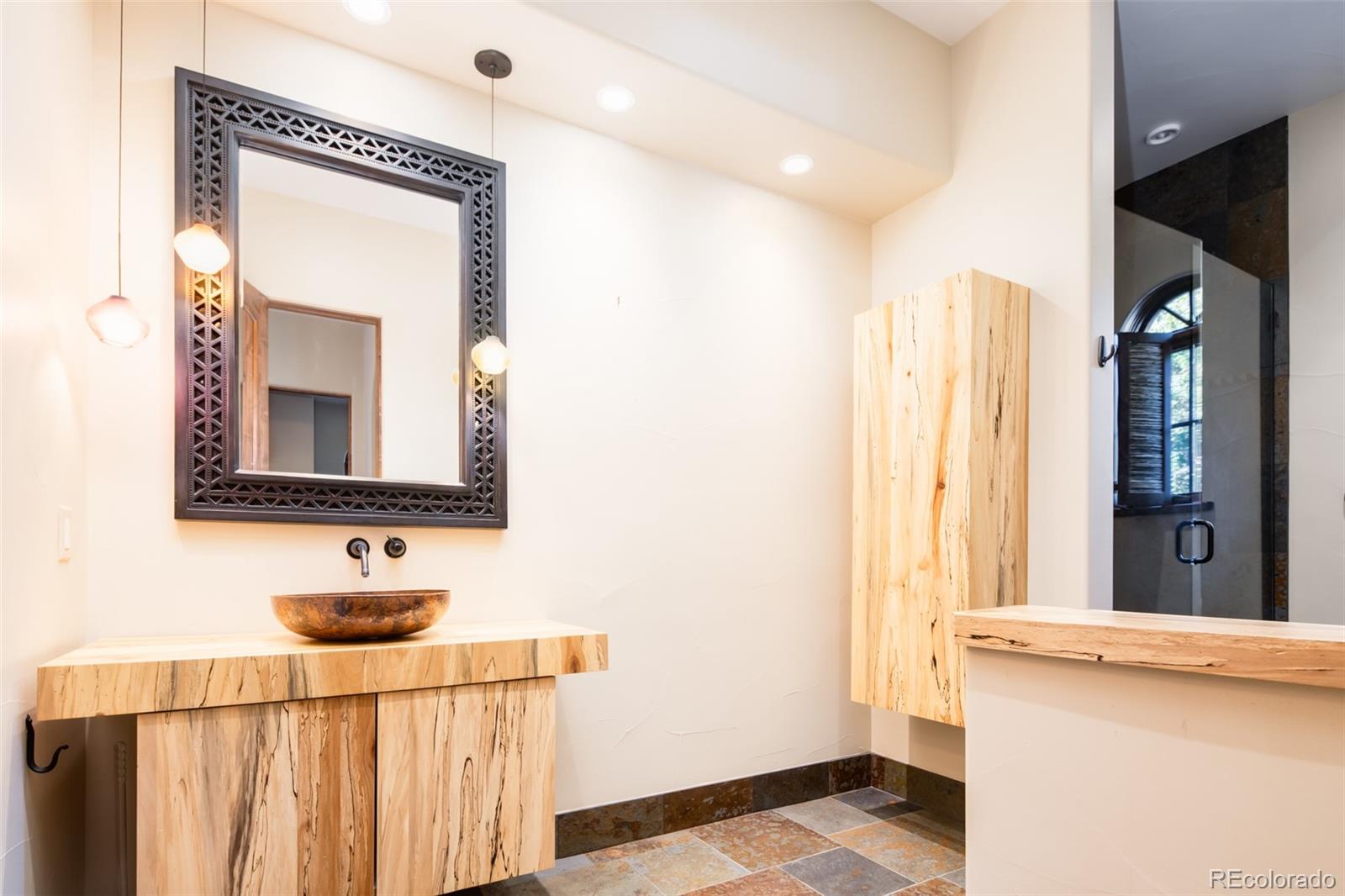 Main Floor Bathroom with Pine Beetle Kill Vanity and Cabinet