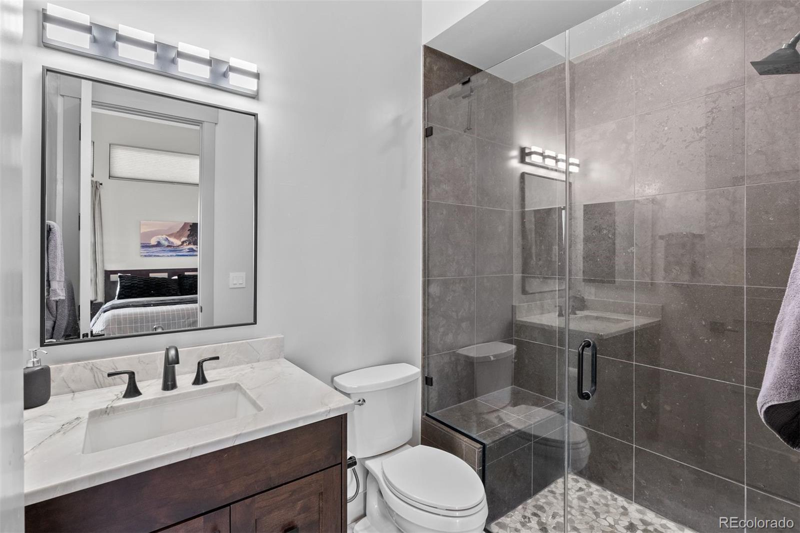 This bathroom features a spacious walk-in shower