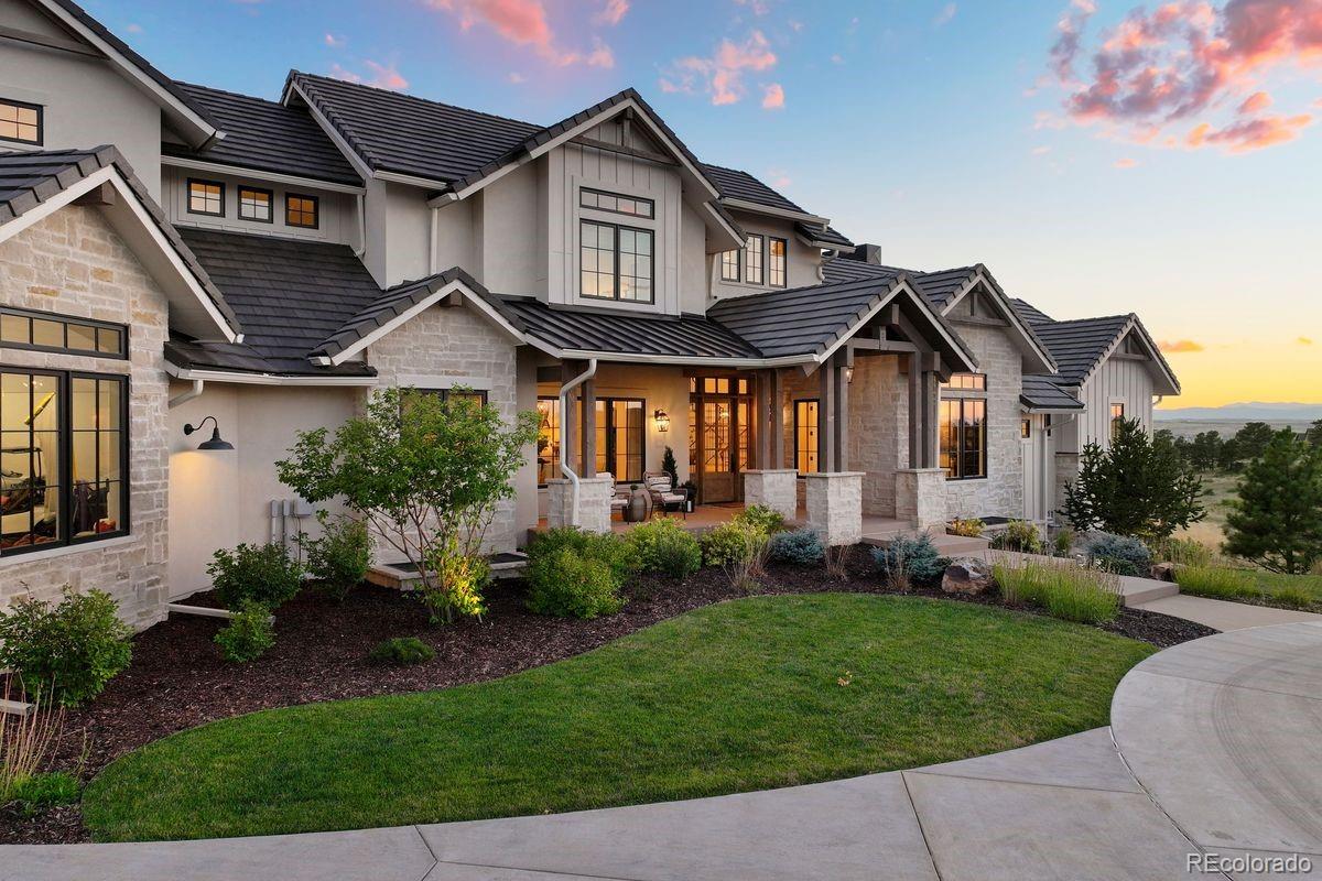 The exterior is stunning and is surrounded by lush landscaping.