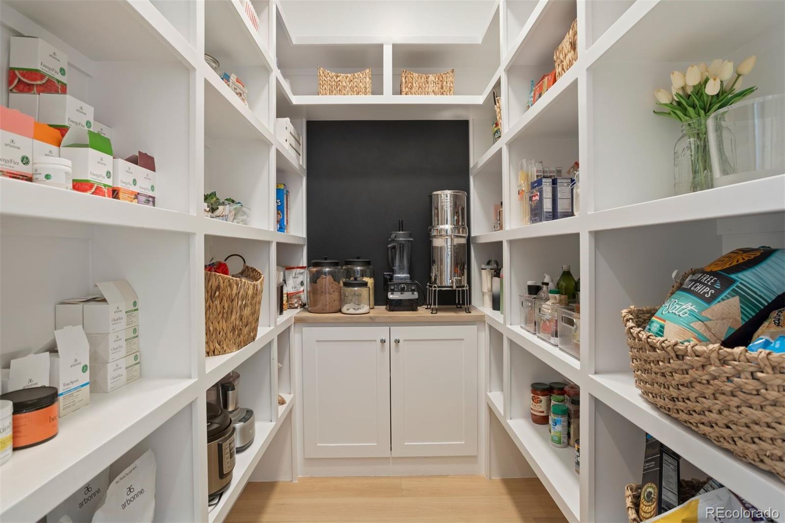 Walk-in pantry with custom shelving system.