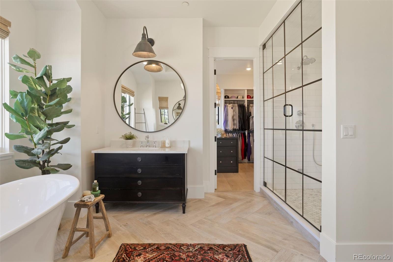 Primary bathroom walk-in shower and closet.