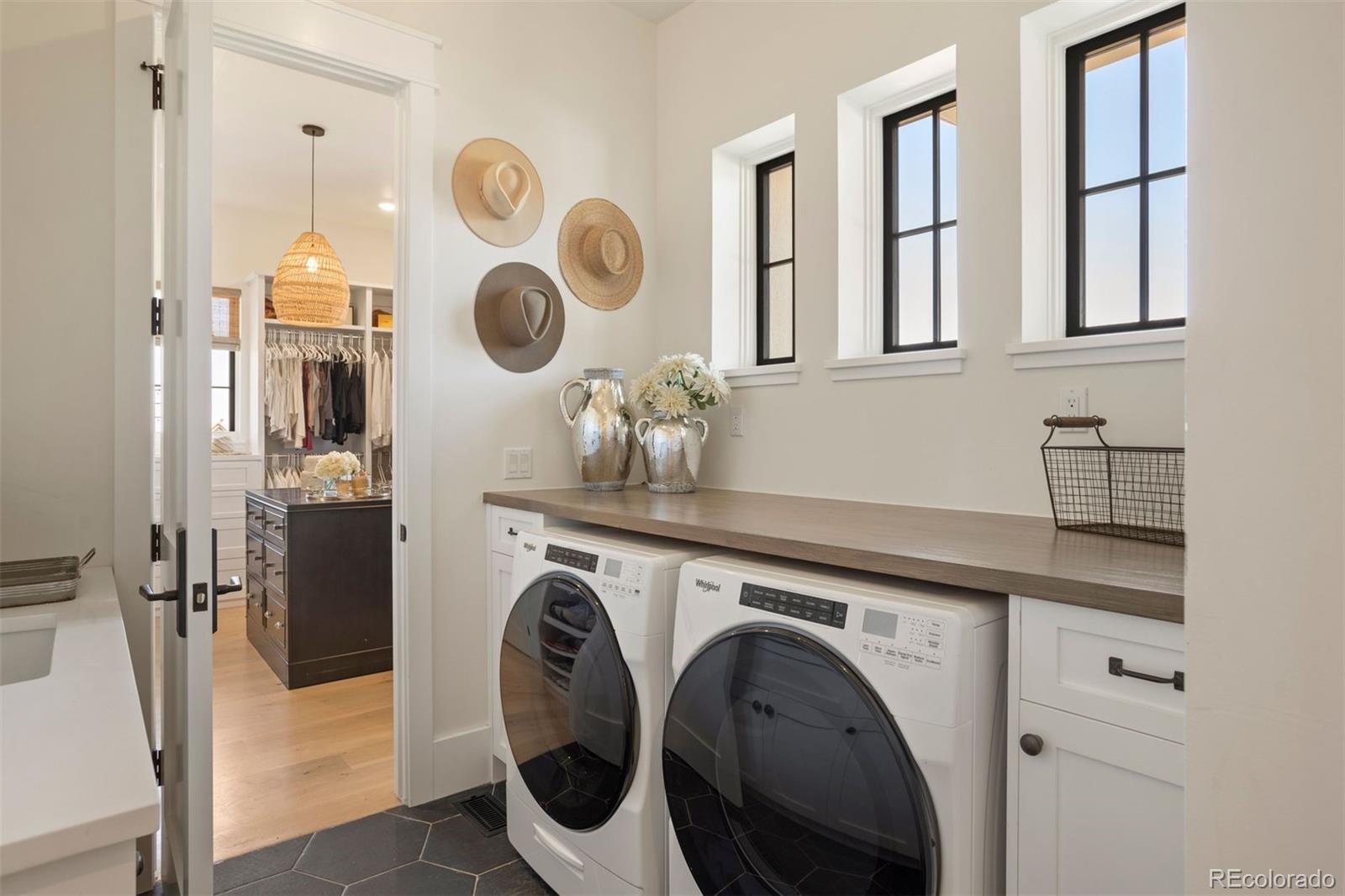 The main-floor laundry room is attached to the primary closet.