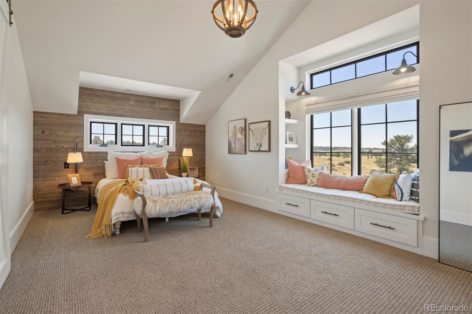 Upstairs bedroom three with natural shiplap wall and window bench.