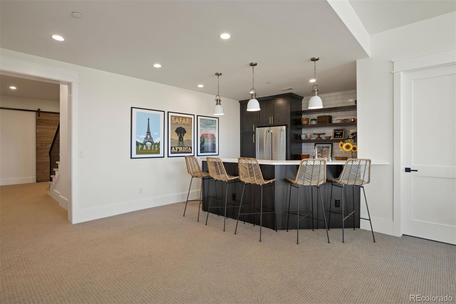 Lower level rec room with wet bar.