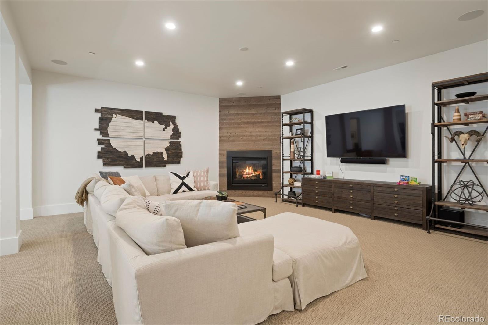 Rec room sitting area with fireplace.