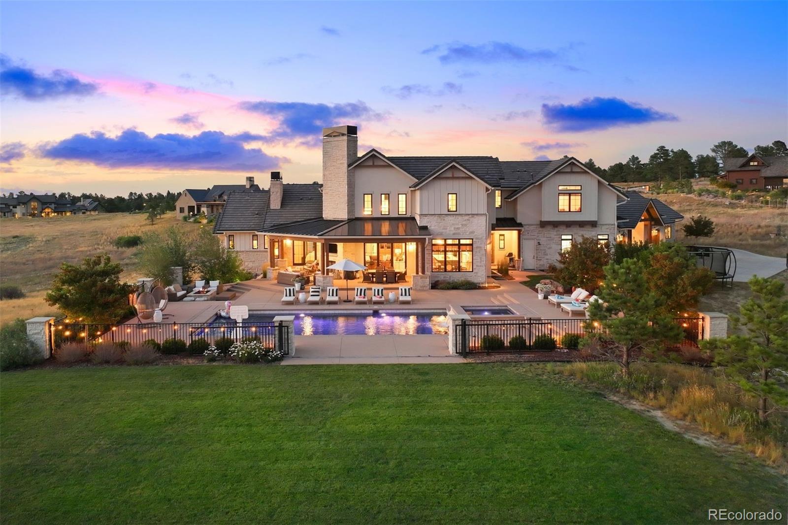 Spectacular outdoor living with saltwater pool, spa, expansive patios with fireplace and fire pit.