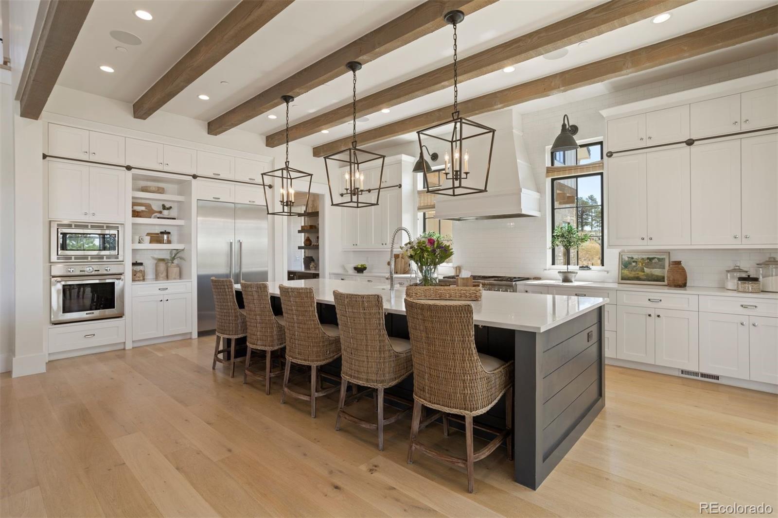 Beautiful kitchen with Thermador® appliances, large center island, and quartzite countertops.