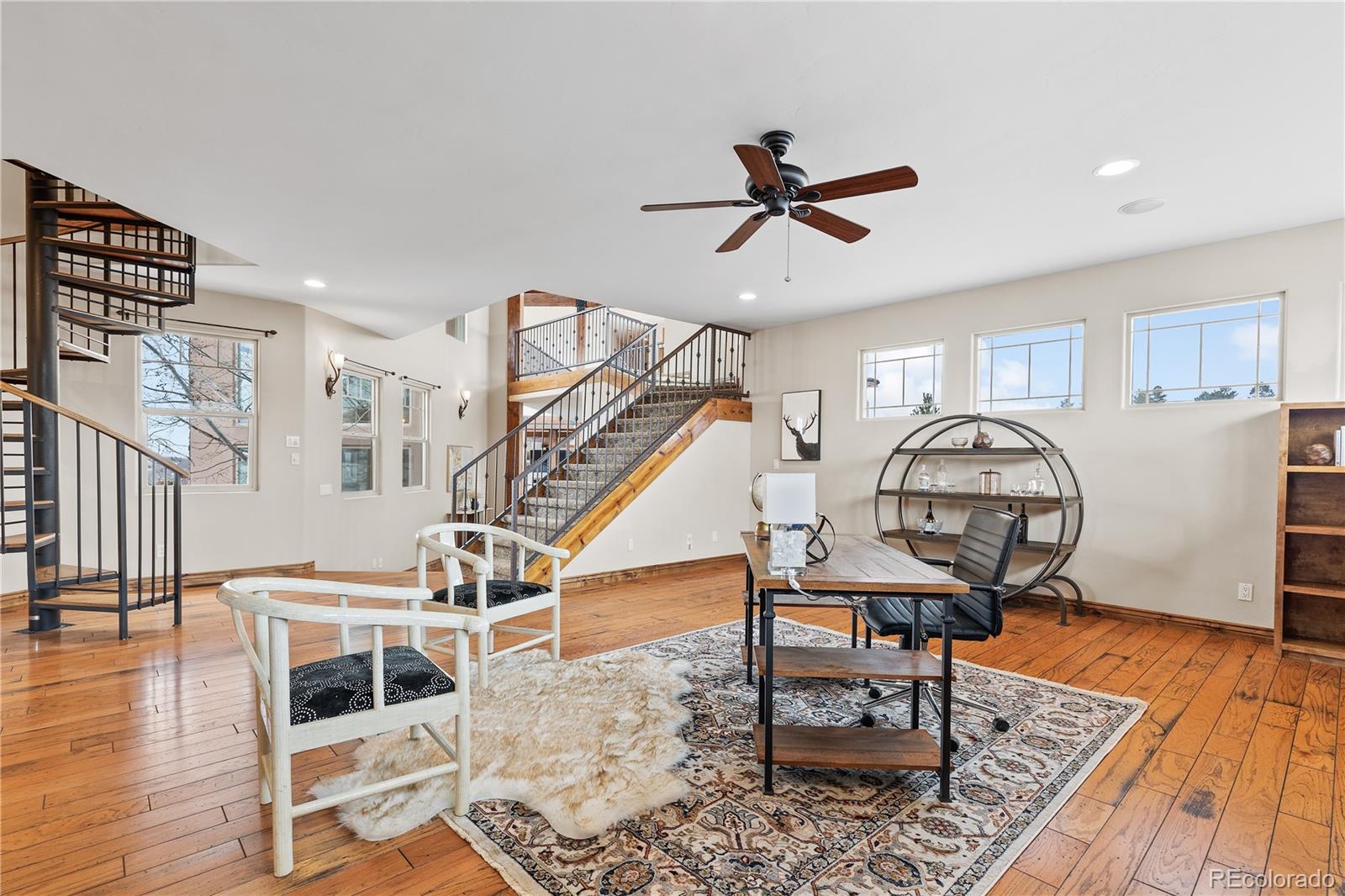 Library/office/den with staircase to lookout room.