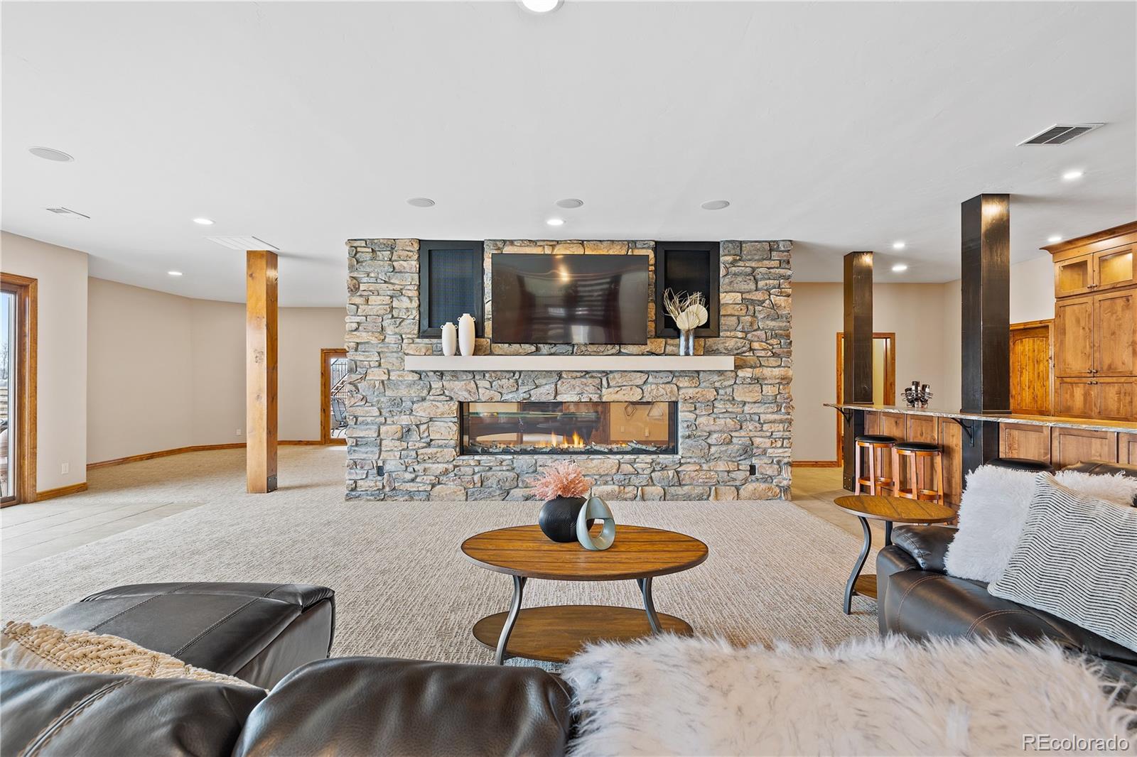 Gorgeous family gathering space with fireplace, wet bar, theater room, game room area, pool table and more!