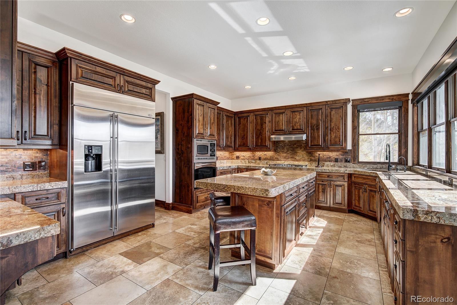 enjoy the chef's kitchen w/tons of counter/island space