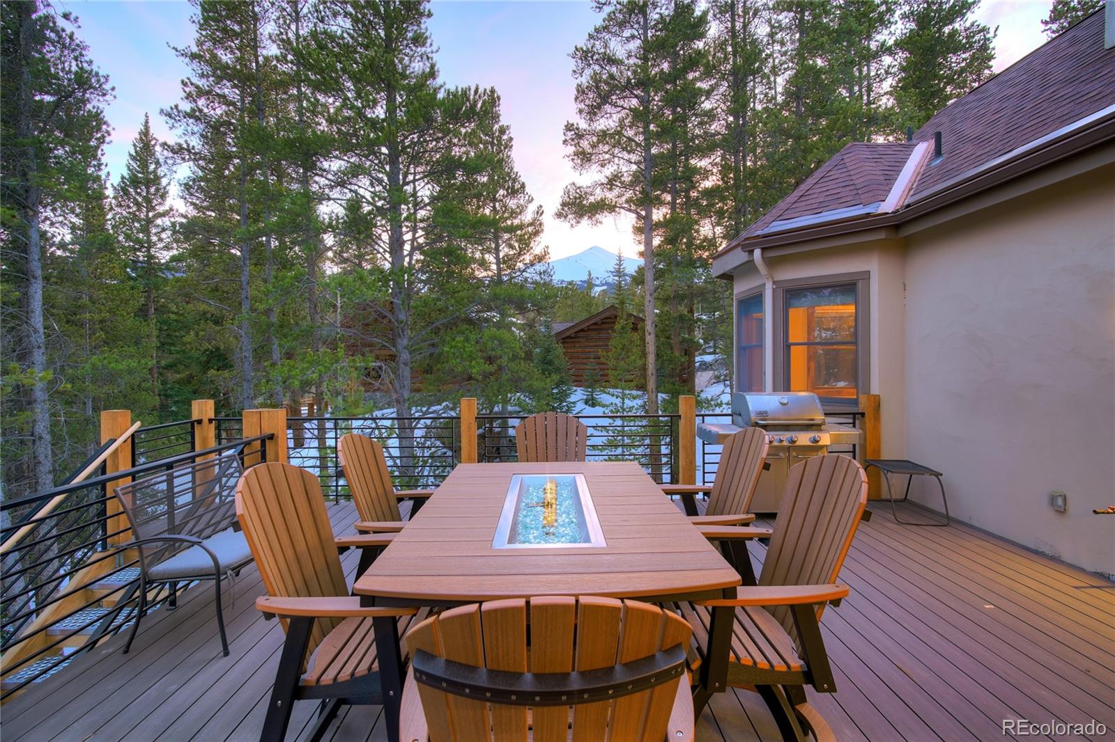 west facing mountain view on upper deck and grill area w/stairs to lower level