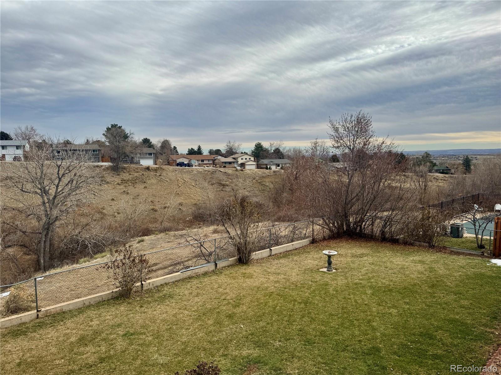 Rear of home backing to open space and level yard with lots of usable space