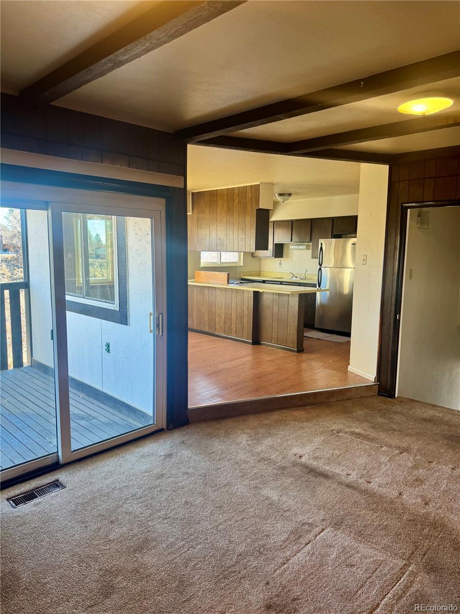 Den area looking into kitchen