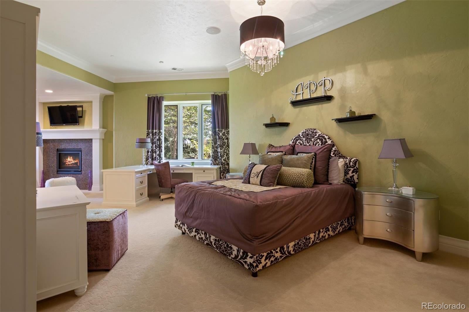 Lower level bedroom suite with fireplace and walk-out.