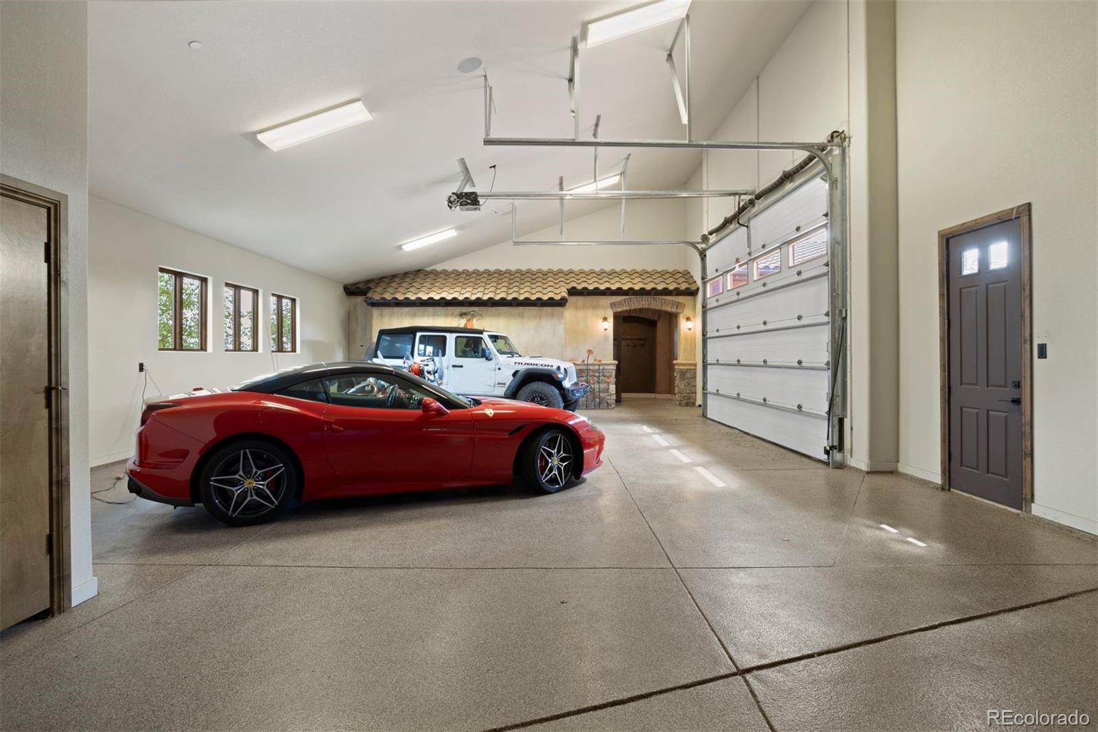 The mega-sided garage is over 3400 square feet with room for over 6 cars., workshop with built-in storage and workspace, ¾ bathroom.