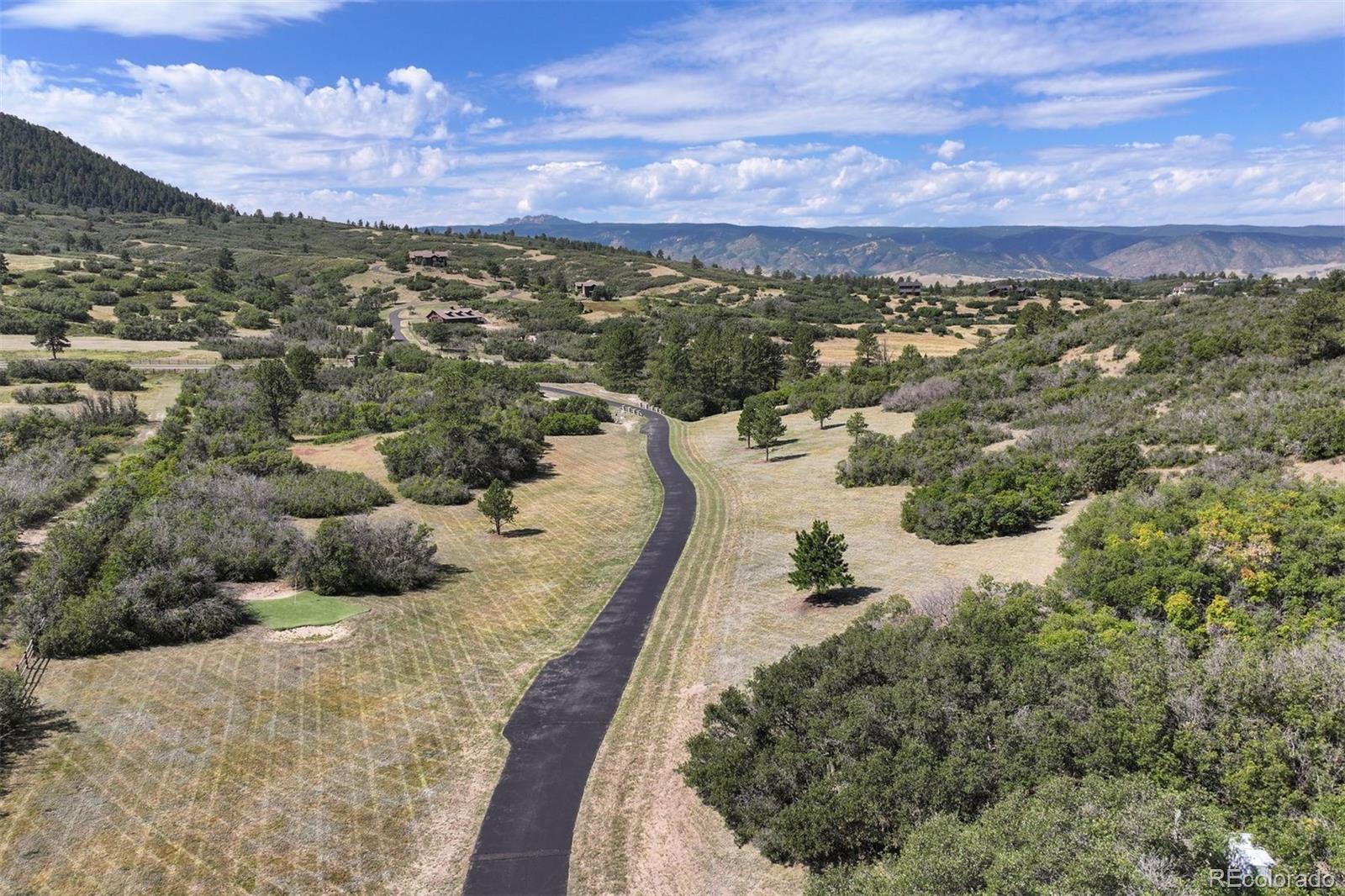 Aerial view looking south-west down the driveway.