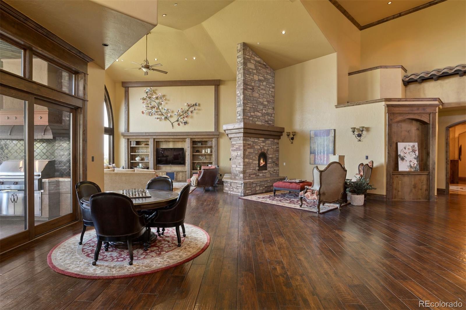 Every detail, from the soaring vaulted ceilings and stunning, hand-hewn wood floors to the five meticulously designed fireplaces, echoes warmth and timeless beauty.