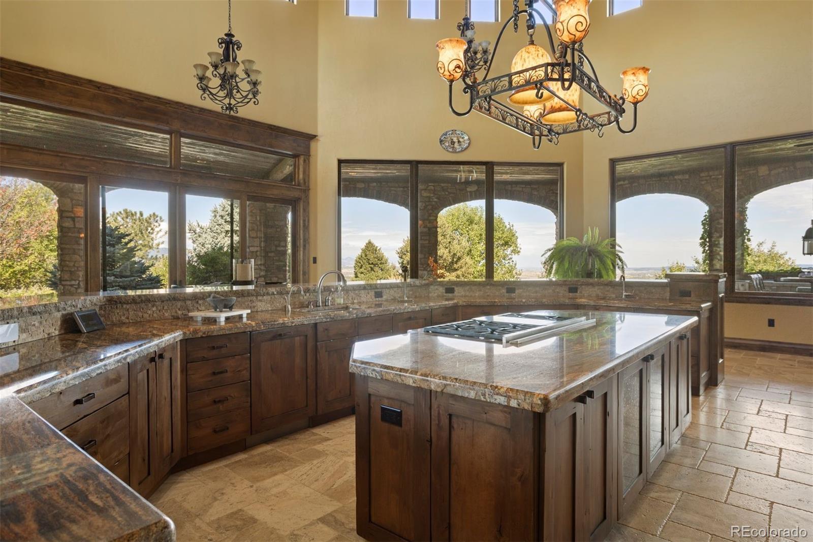 The kitchen features Sub-Zero and Wolf appliances.