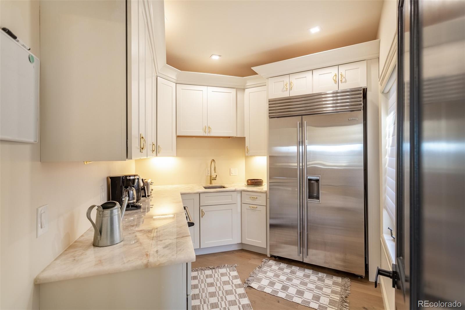 Catering Kitchen off of the main kitchen with a side x side refrigerator