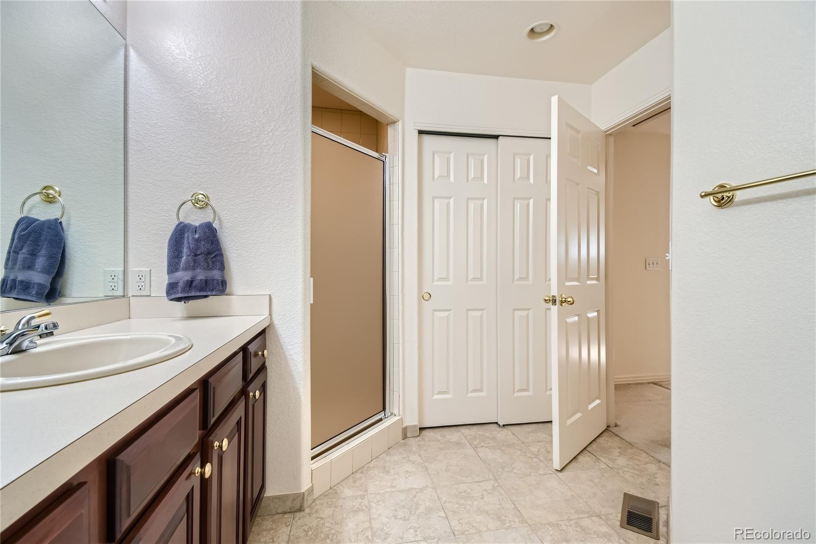 Loft bathroom has storage + walk in closet