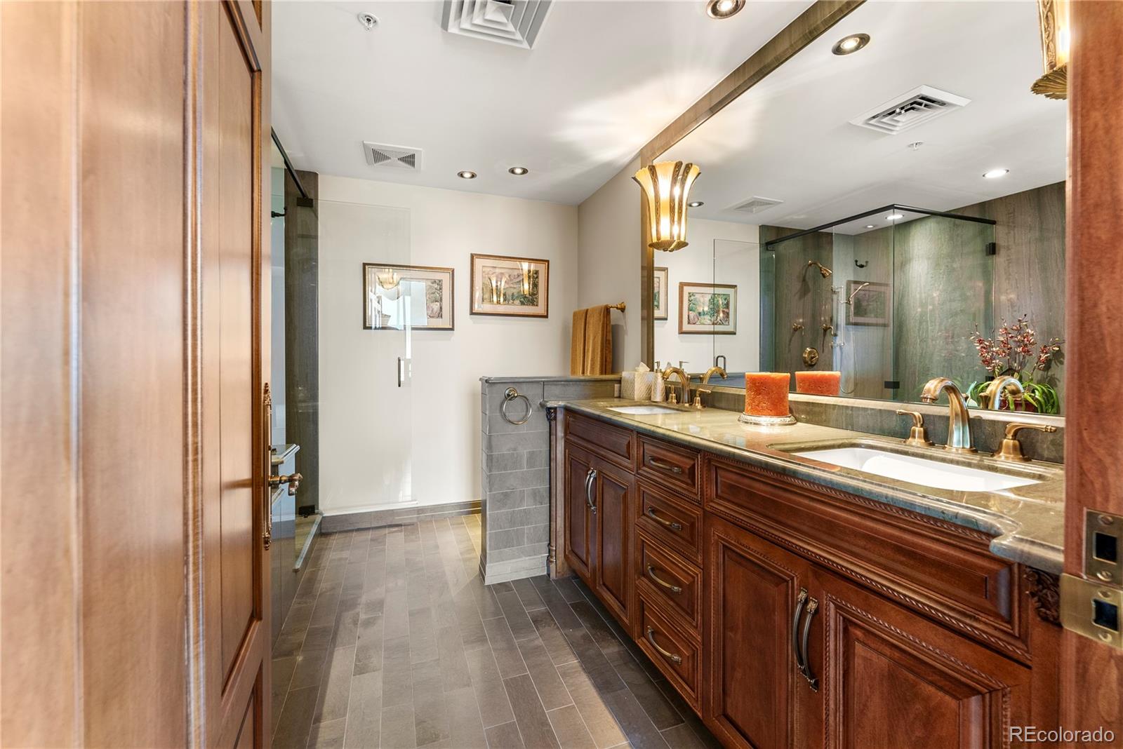 Full bathroom with double vanity across the hall from guest bedroom 2