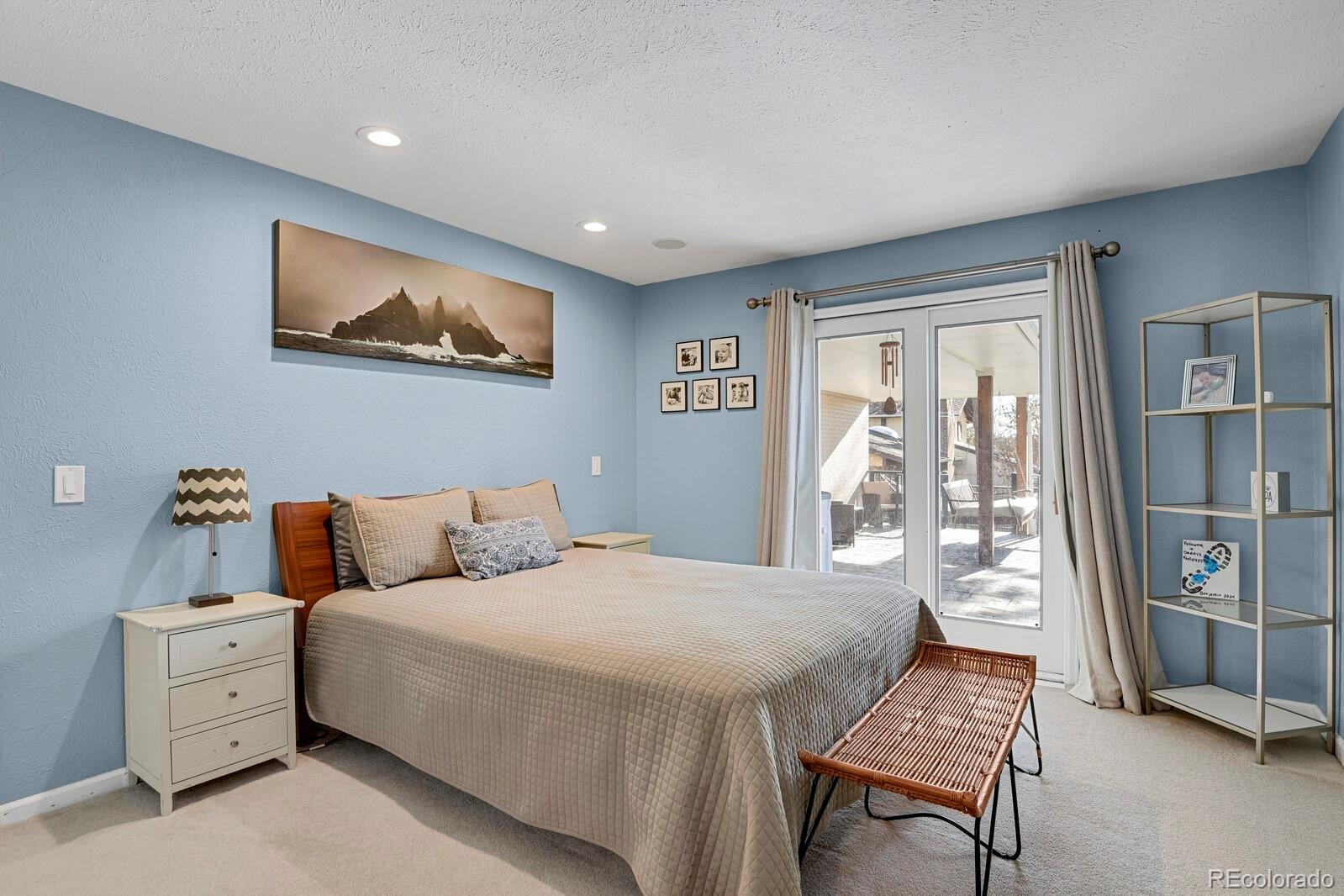 Primary bedroom with access to backyard deck through door