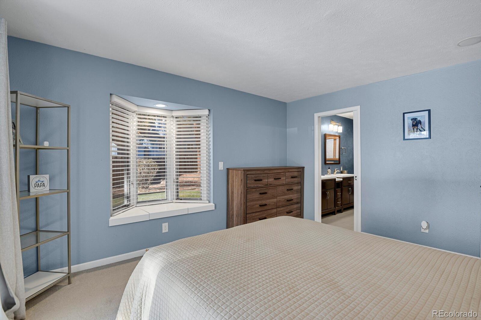 Bay window in primary bedroom with storage