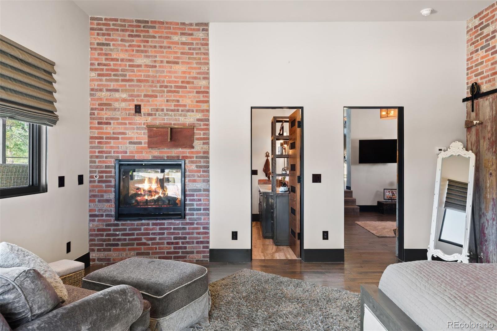 Guest suite fire place with red brick accents.