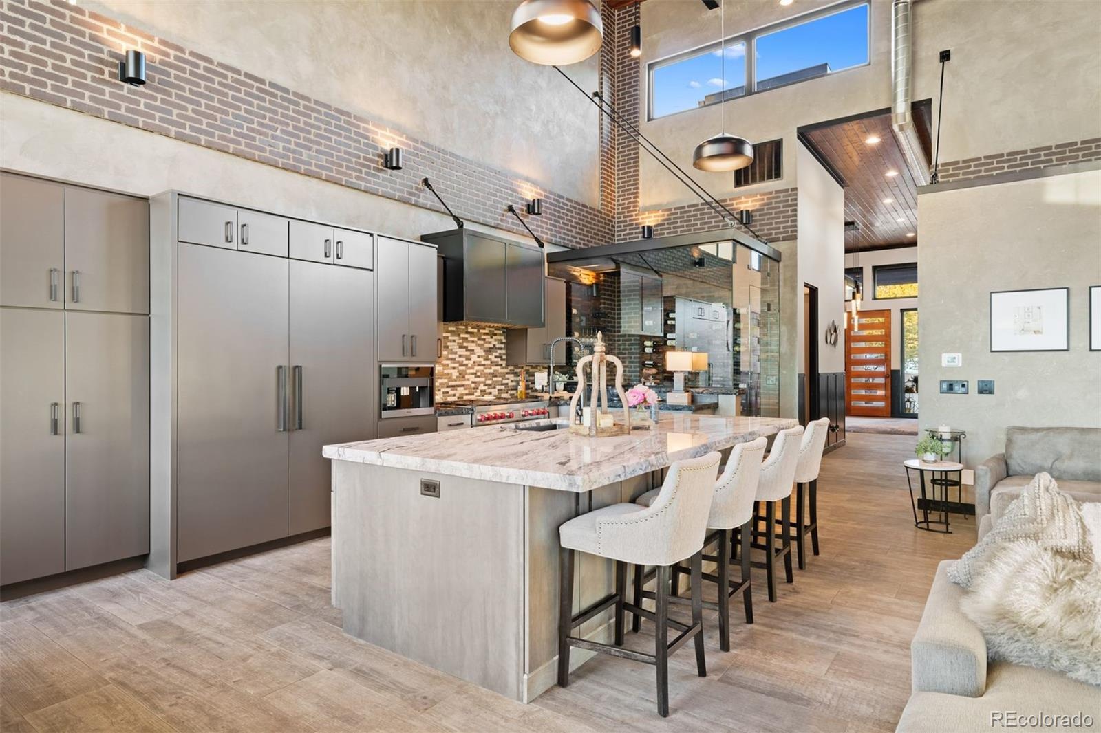 The kitchen is equally remarkable, featuring a Wolf range, 60-inch Sub-Zero refrigeration, a 10-foot island.