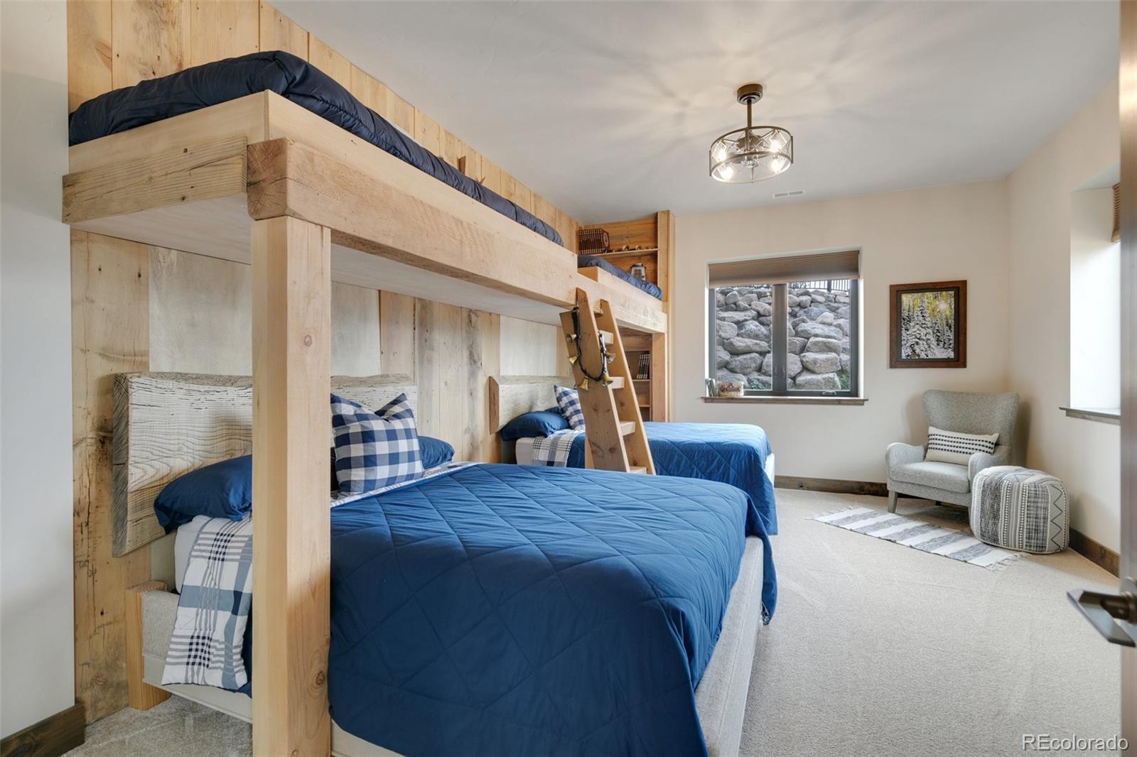 Lower level bunk room has Douglas Fir Beds and 1820 church floor walls and ladder.