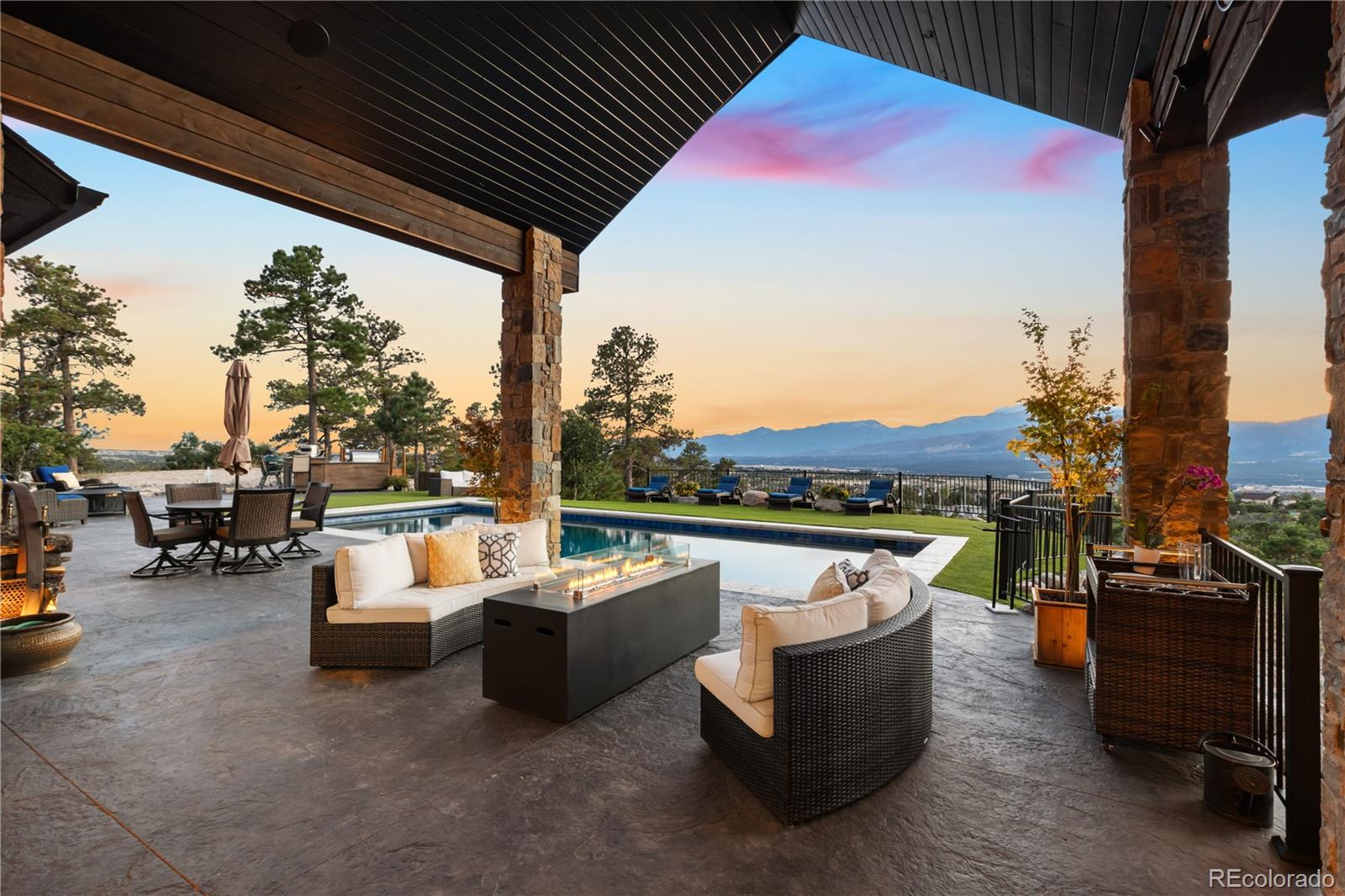 Stamped concrete covered pool deck with lots of seating, amazing views!