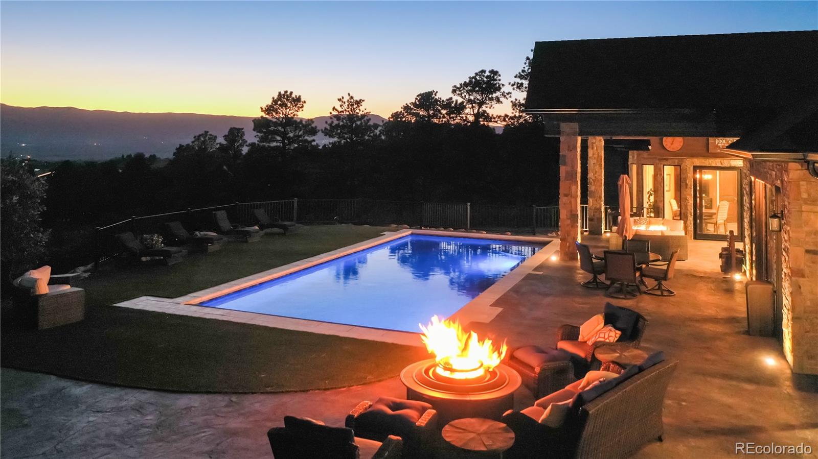 At dusk, the lighted pool and patio offer a relaxing retreat and beautiful views.