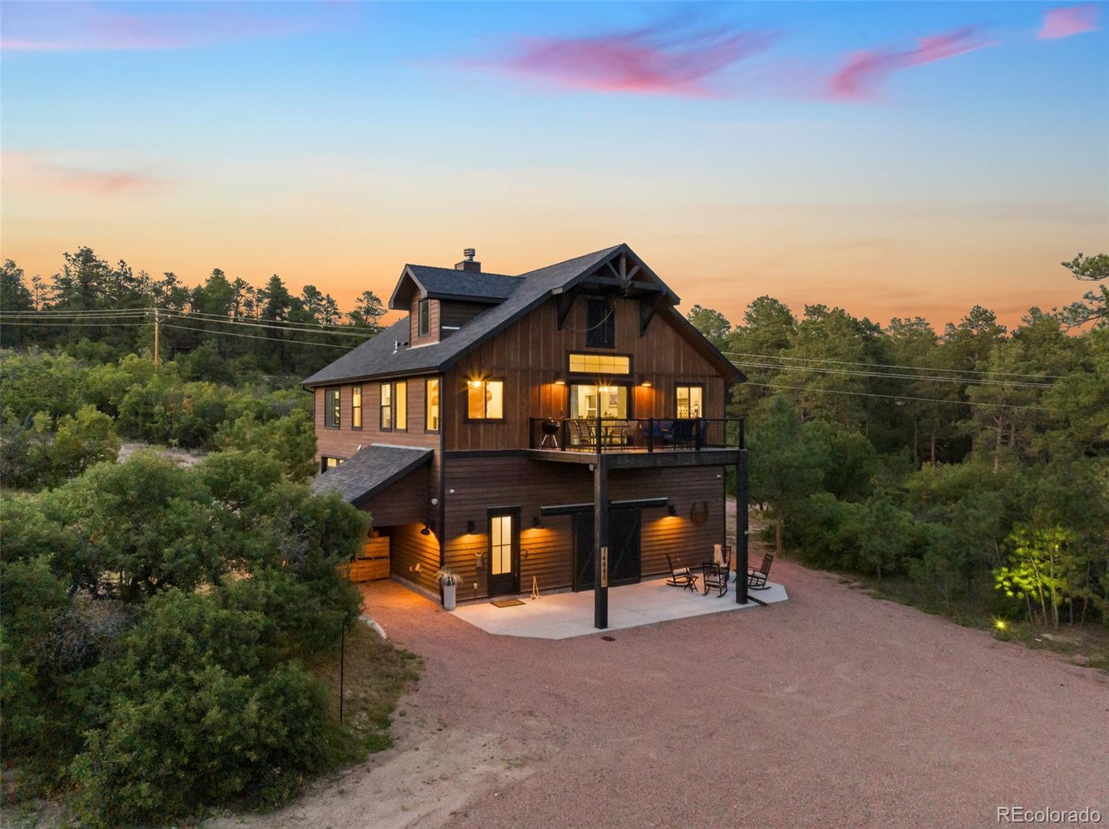 Barndominium with RV storage, clean outs and hookups. Cedar sided; Large Timber Beam support frame; water proof under decking