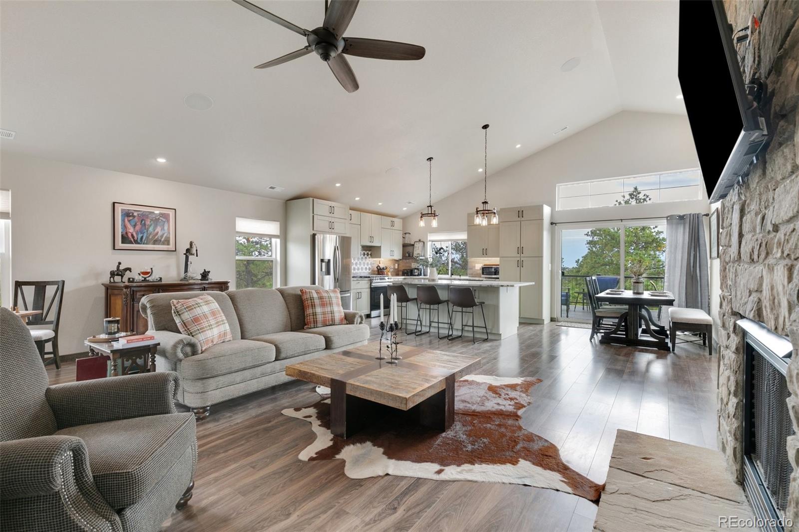 Barn living room opens to kitchen and dining nook; sound system throughout; laundry.