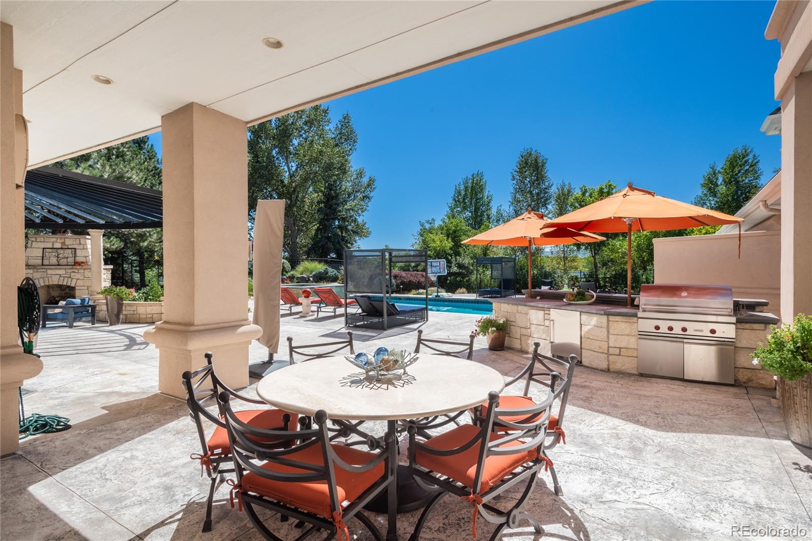 Patio and outdoor kitchen and bar.