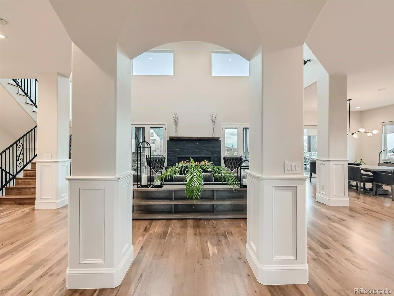 Luxury Estate home has stunning entry foyer opening to to the expansive living space highlighted by linear fireplace accent wall and views of the backyard living space.