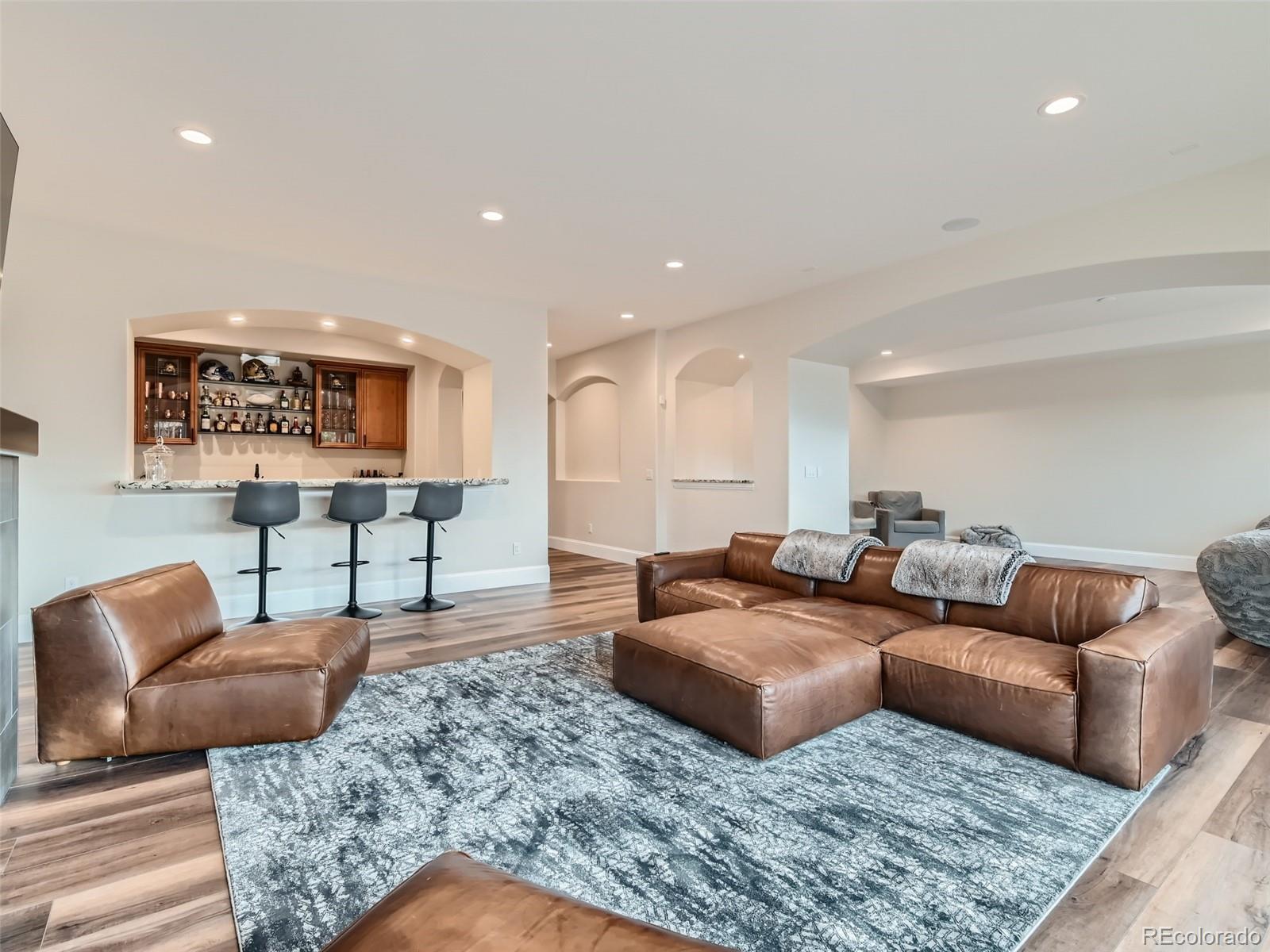 Lower level rec-entertainment area with full wet bar and adjacent game room