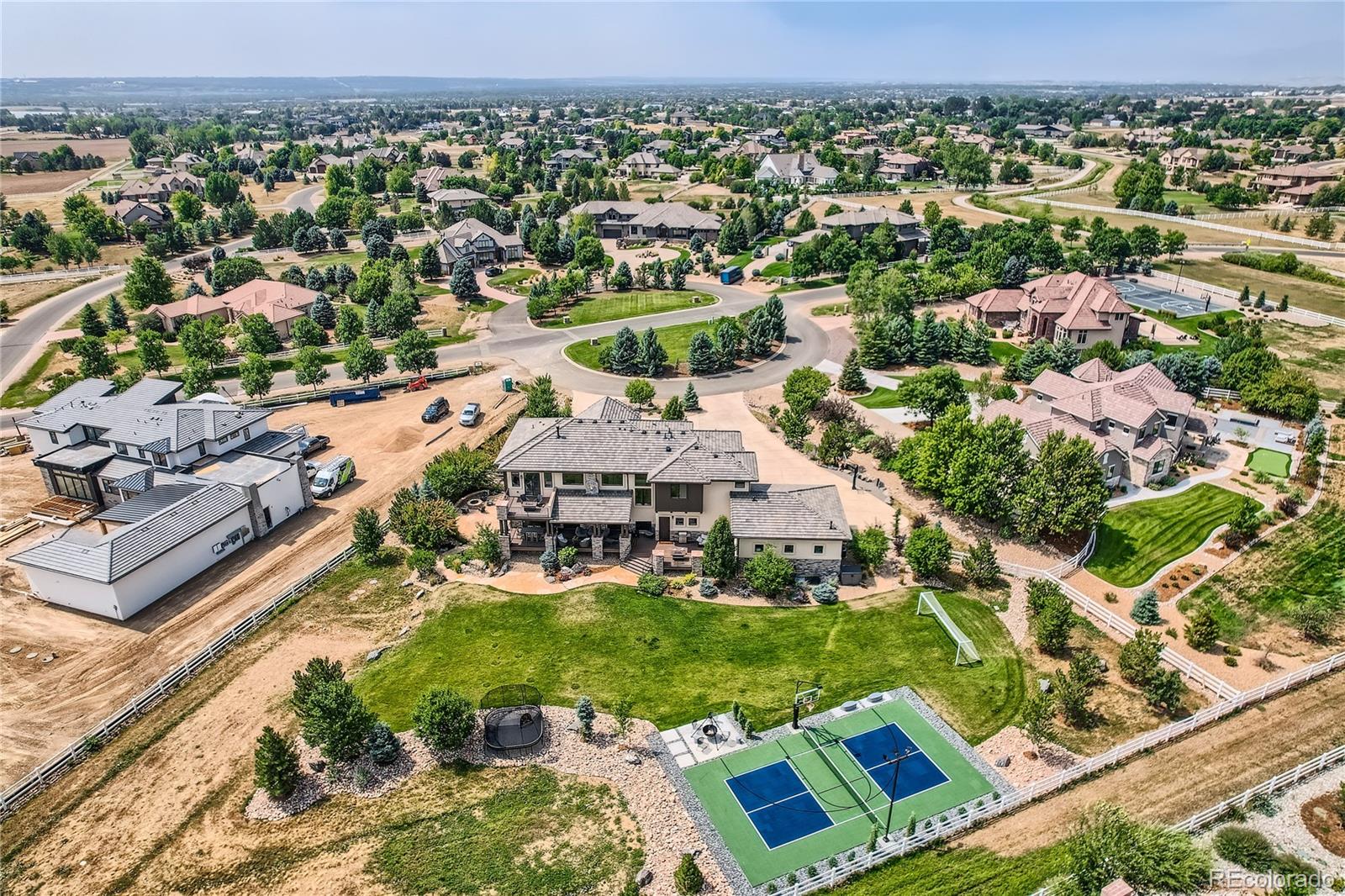 1.43 acre fully landscaped, fenced backyard. Enjoy basketball and pickleball on the new sports court.