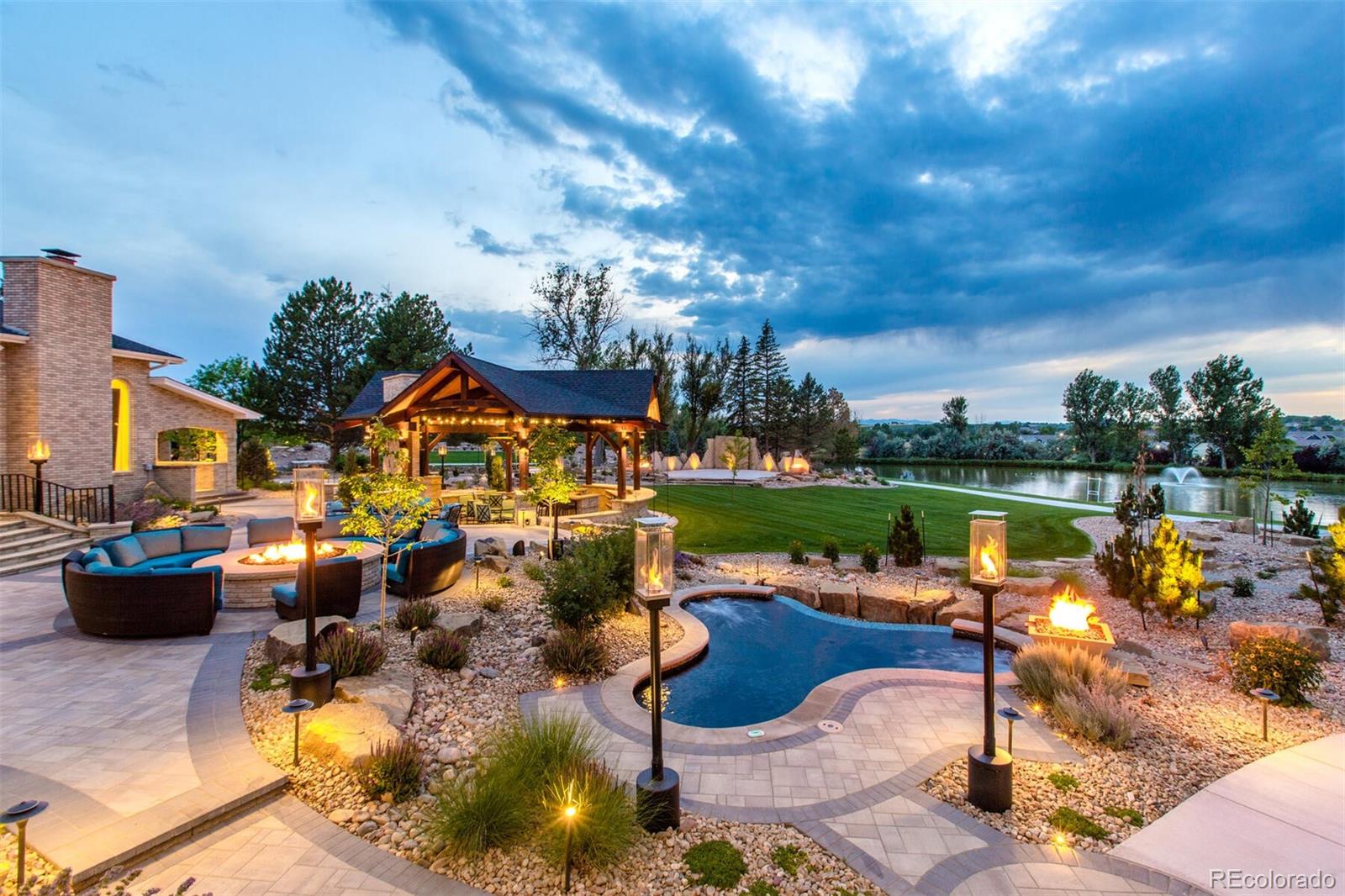 Relax or entertain in the 12+ person hot tub or firepit overlooking Swan Lake