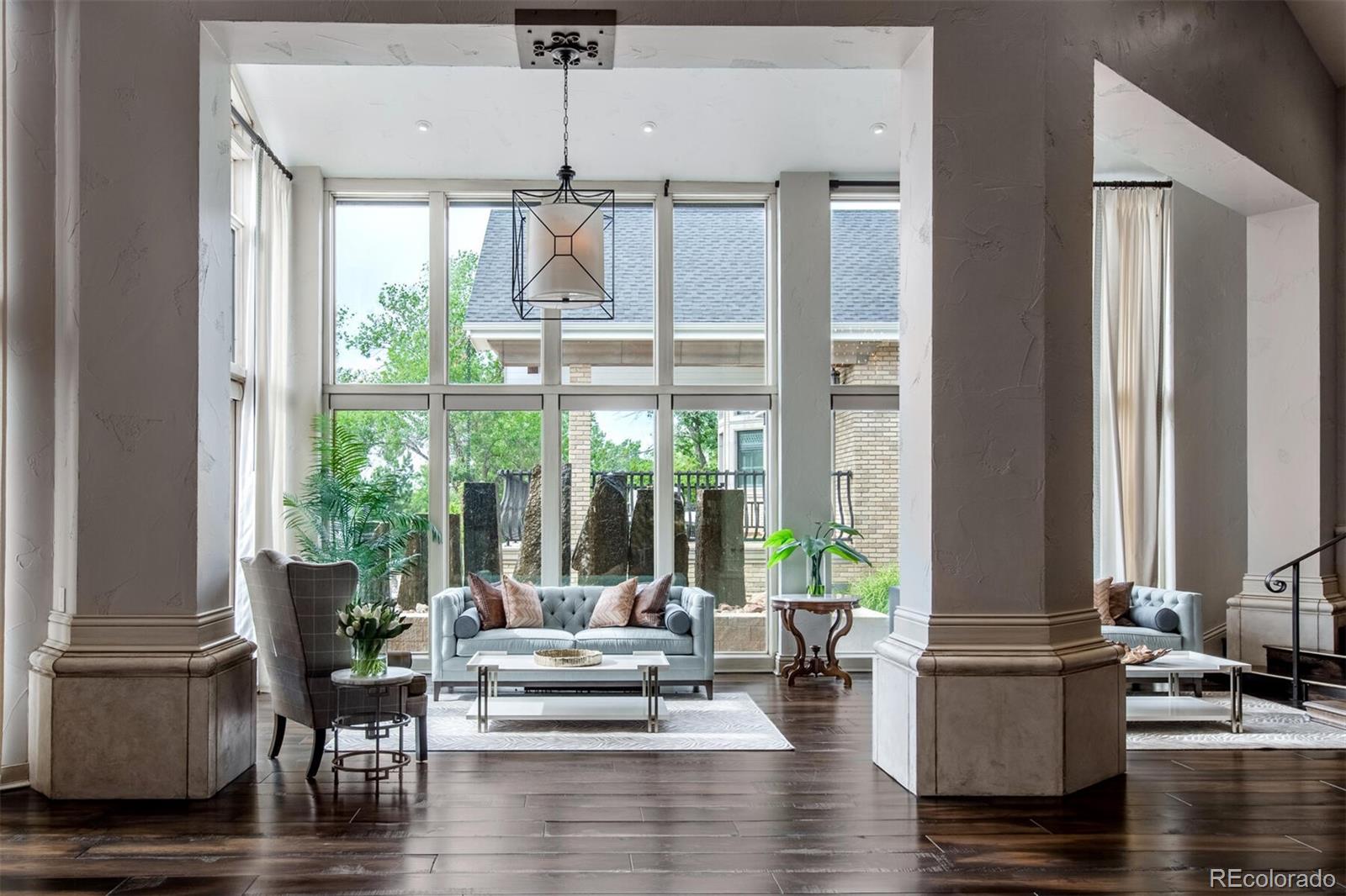 The "jewel box" style sunroom is the ideal place to settle in for an afternoon tea or book or chat with your guests. This quite space is great to get away for a bit with prime views of the Stonehenge style water feature.