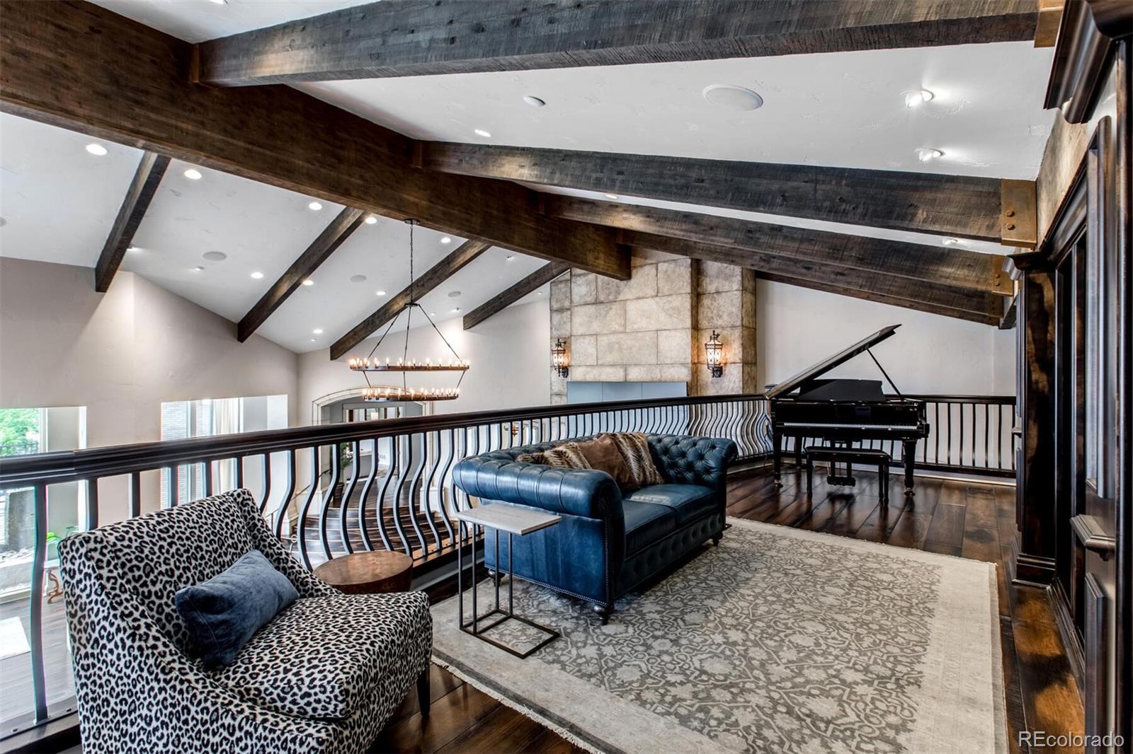 The Library Overlook, complete and included Baby Grand Piano (self-playing), built-in bookcases and iron banister make this space ideal for a lazy Sunday spent reading and listing to your favorite music.