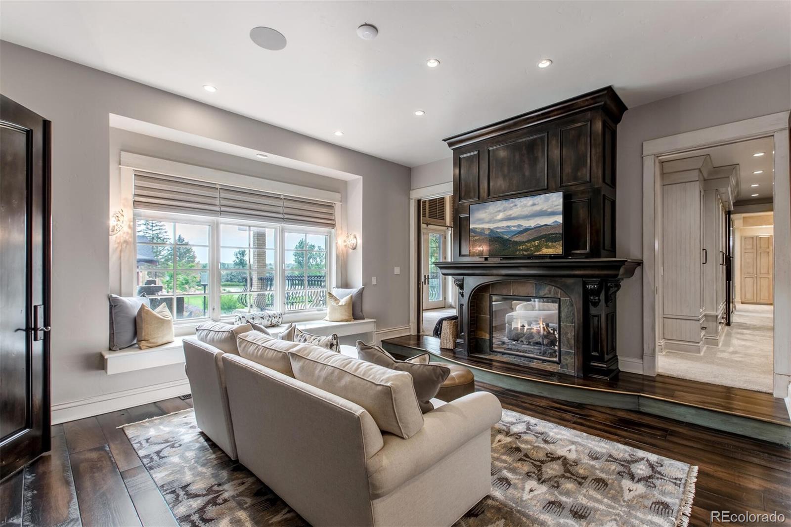 After a long day, seek refuge in the tranquil Owner's Wing where wellness takes center stage. The main floor Owner's Suite, located just off the great room is the ultimate space to renew. A French door entrance, double-sided fireplace, and coffee bar.